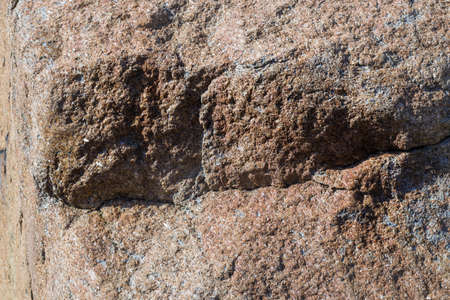 Close up of cracked rock fragment with textureの写真素材