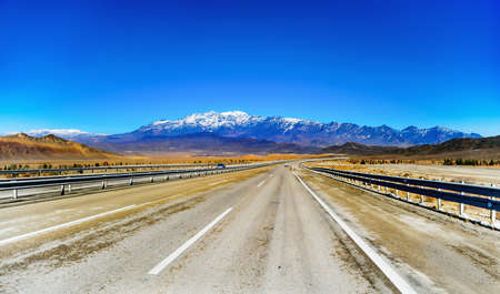 Mountains and motorway in Iran with blue skyの写真素材