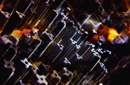 Dark colorful background. Various size threading tools for metal works