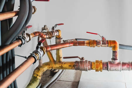 Copper pipes and valves in a boiler room. Close up.