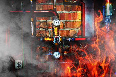 Fire, smoke and steam in a boiler room. Thermometers, pipes, valves and overheated chimney. Close upの写真素材