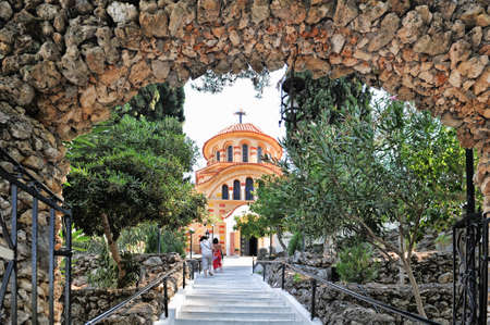 Greece, Rhodes, east coast, Kolymbia (Kolimbia), church Agios Nektarios with Epta Piges (seven sources). View from the gate arch to the church.の写真素材