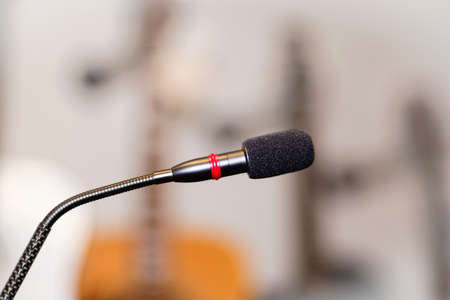Microphone with red lighting ring in a  blurry backgroundの写真素材