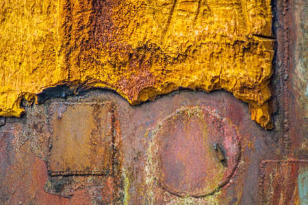 Old colorful polyurethane foam on rusty metallic surface. Close up. For background.