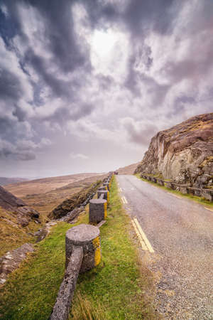 Road at Healy Pass on a cloudy spring  day. County Cork, Ireland.の写真素材