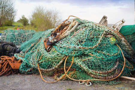 Fishing nets, ropes and rusty chains in a Castletownbere harbor. County Cork, Ireland