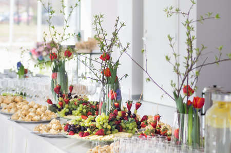 Fruits and beriies in aplte on a buffet table. Close up.