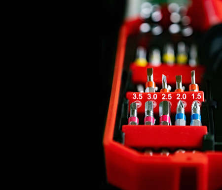 Screwdriver various replaceable tips in red plastic box. Close up.の写真素材
