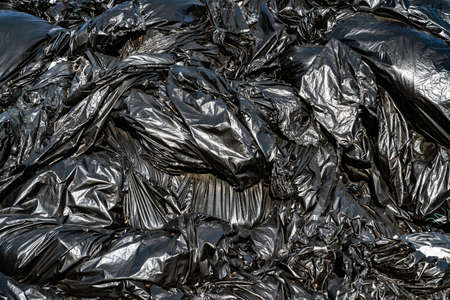 Black polyethylene dump. Ecological concept. Close view.