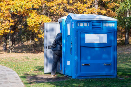 Portable toilet for the disabled in a park.の写真素材