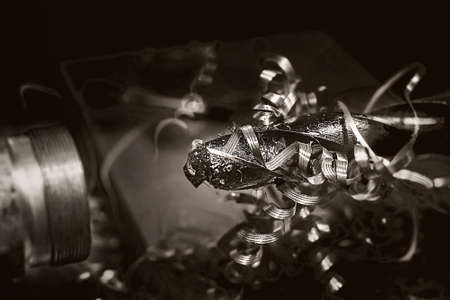Close view of a metal lathe at work. Drill with metal shavings.の写真素材