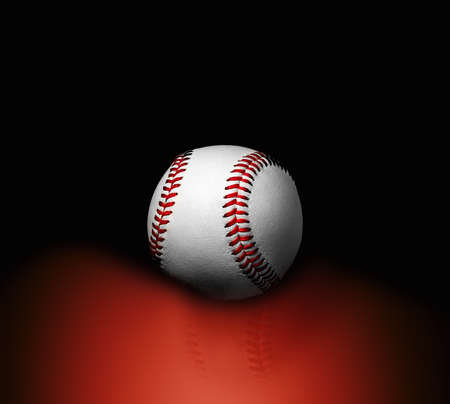 Basball ball on a black background with reflection on red. Close up.の写真素材