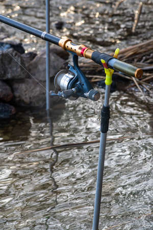 Fishing reels with line on the rods. Close up.