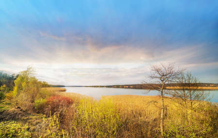Panoramic colorful view of lake on sunset in spring. Lithuania, Kauno marios.の写真素材