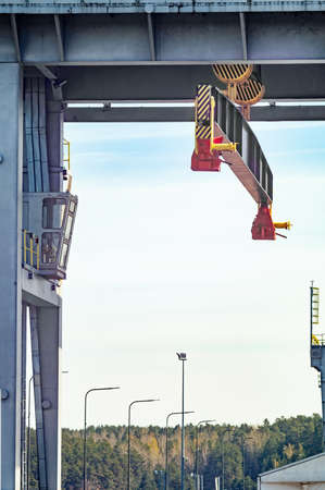 Bridge crane mechanisms on sunny day.の写真素材