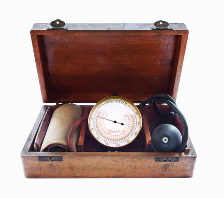 Vintage Tonometer in wooden box. Close up. Isolated on white.の写真素材