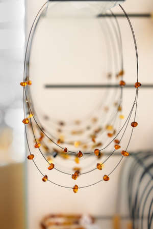 Amber beads on blurry background. Close up.の写真素材