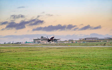 Airplane on the runway in the airport on cloudy day.の写真素材