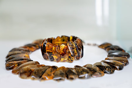 Amber neklaces and bracelet on a bright background. Close up.の写真素材
