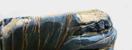 Wet stone on a bright background. Close up.の写真素材