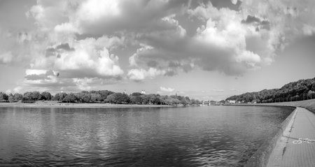Bridge on river Nemunas in Kaunas city on sunny cloudy evening in summer. Lithuania.の写真素材