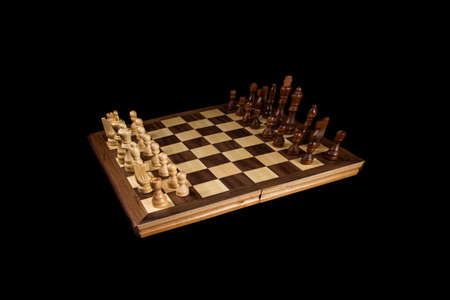 chess a good game for the brain and strategy. wooden chessborad. black vs white. conflict peopleの写真素材