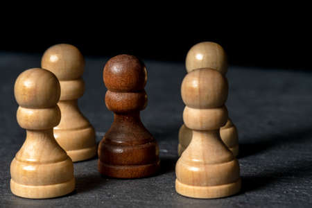 chess a good game for the brain and strategy. wooden chessborad. black vs white. conflict peopleの写真素材