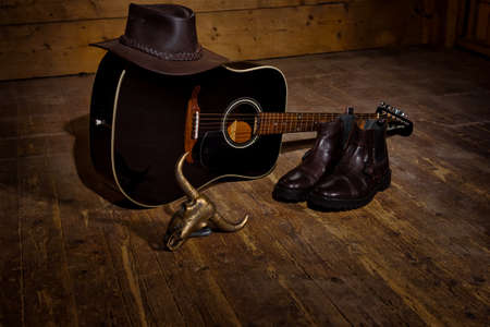 Guiatr for country music a hat and boots all you need to country dance.の写真素材