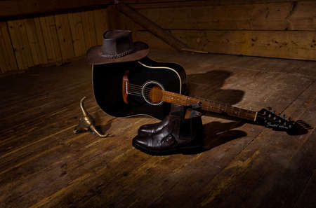 Guiatr for country music a hat and boots all you need to country dance.の写真素材