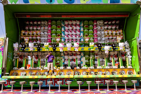 Carnival game at the San Diego County Fair, June 7, 2014 - Del Mar, CA. The thoroughfare of games at the San Diego County Fair. A carnival game on the thoroughfare on the way to carnival rides. Photo taken on June 7, 2014.のeditorial素材