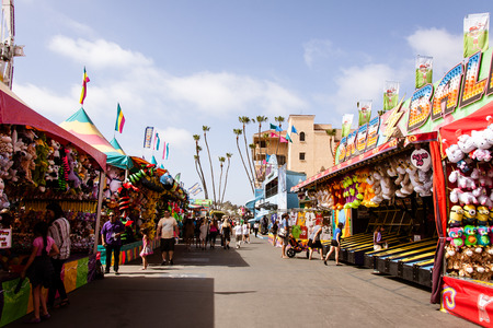 Midway at the San Diego County Fair, June 7, 2014 - Del Mar, CA. The thoroughfare of games at the San Diego County Fair, formerly known as the Del Mar Fair. Carnival games line this thoroughfare on the way to carnival rides. Photo taken on June 7, 2014.のeditorial素材
