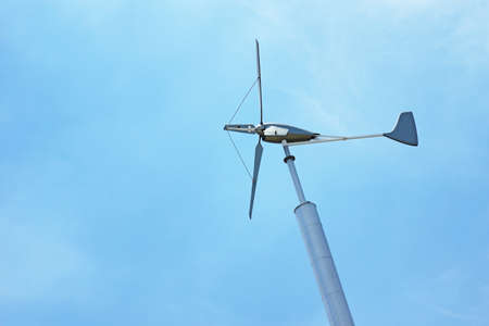 Windmill against blue sky