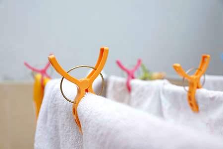 Colorful clothes pegs on clothes line