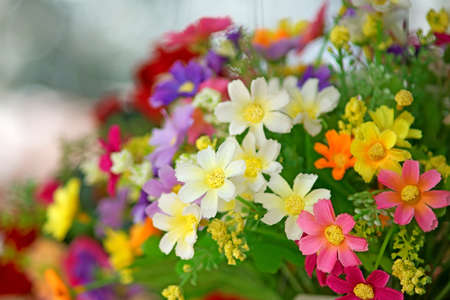Bunch of colorful artificial flowersの写真素材
