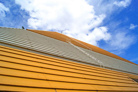 roof of convention hall under blue skyの写真素材