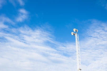 Spotlight against blue skyの写真素材