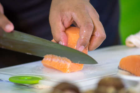 Slicing Salmon - Japanese cuisineの写真素材