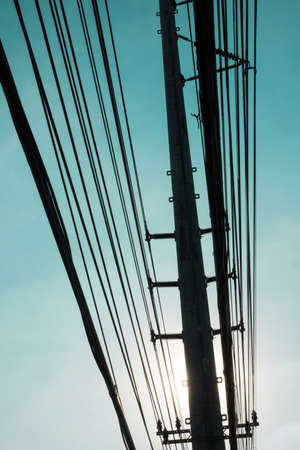 silhouettes of electric poleの写真素材