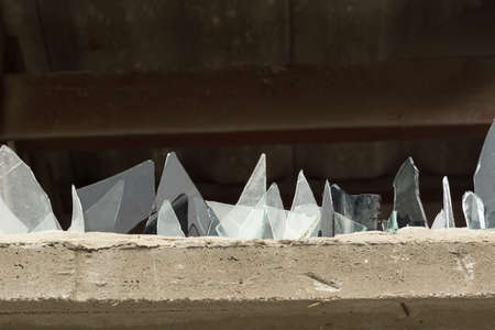 A wall with glass pieces for protection of intrudersの写真素材