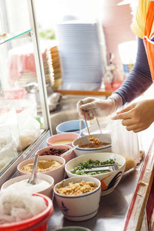 Chef cooking noodle at noodle shop - Thailand street food