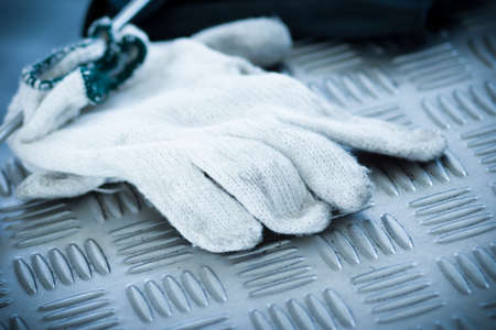 Work Gloves on checkered steel plate - Retro styleの写真素材
