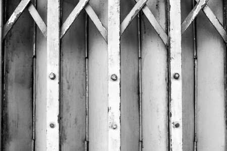 Metal roller shutter door background - black groundの写真素材