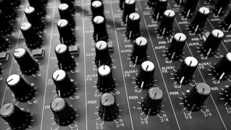 buttons equipment in audio Mixing Console - black and white