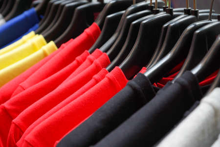 Cloth Hangers with colorful T-Shirts in the store