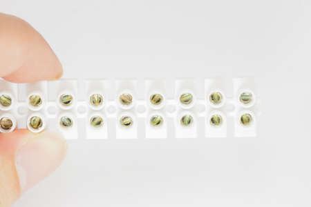 Hand grab a Screws Clamp Terminal Blocks for advertisement  - front viewの写真素材