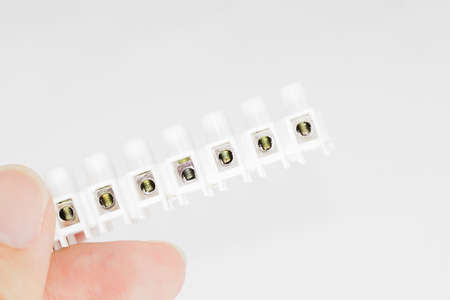 Hand grab a Screws Clamp Terminal Blocks for advertisement  - side viewの写真素材