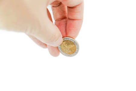 Hand holding Thai coin isolated on white background - Financial Wealth conceptの写真素材