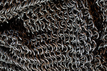 Metal chain armor as a background. Macro. Selective focus.の写真素材