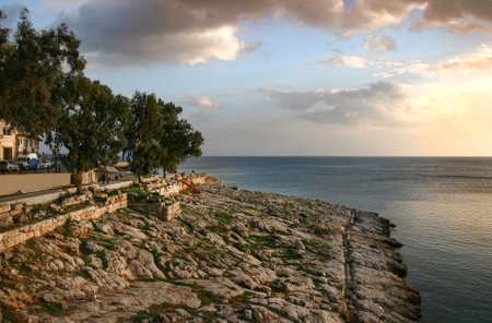 sunset over the sea and Peiraiki area at Piraeus, Greeceの写真素材