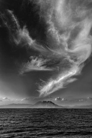 Deserted small island and a big cloud aboveの写真素材